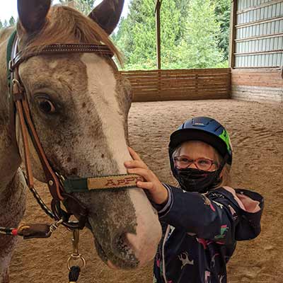 Student with Snow the Pony