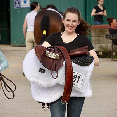 Deerfield Farm student with saddle