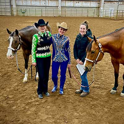 Two Deerfield equestrian team members at show